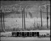 [Korean War - 1953:Operation Big Switch POW ExchangeMen inside mail room sorting mail (dark).n00:01:05t13:23:27MS MP at three way crossing, directing traffic; PAN to follow passing truck.POV from truck of jeeps.n00:01:42t13:24:04MS Men unload from trucks.(dark)n00:02:09t13:24:31Slate:26???53Camera: H.W. Lovejoy. MS North Korean prisoners march up from dockMilitary Police watching in FG.MS MP on dock; landing craft arrivinghand around bayonet in FG.LS marching up d