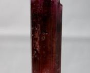 Gem Elbaite variety Rubellite with an intense raspberry color, very good transparency and brilliance and with nice striations on the lateral faces. It is perfectly terminated on the upper with well defined pyramidal faces and the flat pinacoid. There is not damage. Specimen size: 4.5 cm x 1.5 cm