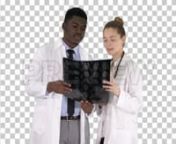Get 100&#39;s of FREE Video Templates, Music, Footage and More at Motion Array: http://bit.ly/2SITwWM nnnGet this here: https://motionarray.com/stock-video/doctors-examining-scans-167276nnDoctors Examining Scans is an incredible stock video that displays alpha matte footage of an African-American male doctor and a Caucasian female doctor examining a radiology scan exam. This 3840x2160 (4K) footage is perfect to use in any project that relates to radiography health, medical exam, x-ray, and the like.