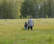 Get 100&#39;s of FREE Video Templates, Music, Footage and More at Motion Array: https://www.bit.ly/2UymF81nGet this here: https://motionarray.com/stock-video/grandma-and-grandson-in-woods-84001nnThis stock video features a long shot of a grandmother with her little grandson walking in the woods. The two are holding hands walking in tall grass with a thick forest in front of them. Use this video as a supplemental footage in your vlogs, TV shows, commercials, documentaries and other videos related to