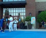 A Cary, North Carolina Martial Artist performs a roll and hammerfist break. karate apex, nc, martial arts morrisville, taekwond