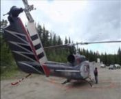 Flying concrete to new ski lift tower foundations using a Bell 214 helicopter.