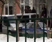 A high-school student opened fire in a Russian school on Monday, killing one teacher and one police officer and holding more than 20 students hostage before being stopped by officials.