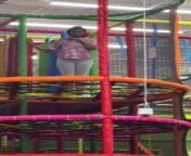 This woman attempted to jump off the net trampoline tower. She hilariously lost her wig as she made her way down through the obstacles. Her boyfriend chuckled as he watched her loose her wig.