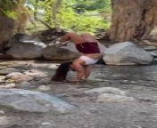 The woman performed different handstand positions beside a small stream.&#60;br/&#62;&#60;br/&#62;“The underlying music rights are not available for license. For use of the video with the track(s) contained therein, please contact the music publisher(s) or relevant rightsholder(s).”
