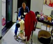 A dad showed quick reflexes to save his daughter - as she tumbled out of her stroller.&#60;br/&#62;&#60;br/&#62;Zhang Jinxia was feeding his 17-month-old when she fell sideways.&#60;br/&#62;&#60;br/&#62;Luckily he managed to grab her before she hit the floor - while keeping hold of the food bowl.&#60;br/&#62;&#60;br/&#62;As the child starts to cry, Zhang picks her up and pats her head to comfort her.&#60;br/&#62;&#60;br/&#62;The video was filmed in the city of Hefei, China on May 5, 2024.