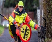 Credit: SWNS &#60;br/&#62;&#60;br/&#62;A lollipop lady has teamed up with a surprising colleague to help children across the road - her pet CAT.&#60;br/&#62;&#60;br/&#62;Klara Remmington, 45, and Bandit, a five-year-old moggie, work a crossing together in Bushey, Herts., every weekday morning and afternoon.&#60;br/&#62;&#60;br/&#62;The cat started tagging along a few months ago and is now a regular fixture.&#60;br/&#62;&#60;br/&#62;School crossing patrol Klara, who has been a lollipop lady for eight years, says the children and parents at Highwood Primary love Bandit.