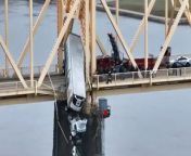 Louisville, Kentucky emergency crews repelled off the Clark Memorial Bridge, also known as the 2nd Street Bridge, on Friday to rescue a driver of a semi-truck who was dangling over the Ohio River.