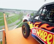 Team Hot Wheels Yellow Driver, Tanner Foust, breaks the world record for distance jump in a four-wheeled vehicle before the Indianapolis 500 on May 29th 2011. Watch what it&#39;s like to drop 10 stories down 90 feet of orange track and soar 332 feet through the air.